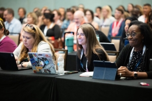 Attendees are learning and smiling during a session at a previous ATIA conference.
