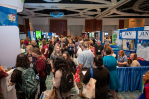 A packed Exhibit Hall of attendees at ATIA 2024 explore the latest products in assistive technology.
