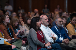 ATIA 2024 conference attendees listen intently to Assistant Secretary Glenna Wright-Gallo from OSERS/Department of Education give her session about new Dept of Ed AT guidance.