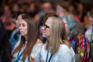 ATIA 2024 conference attendees listen intently to Assistant Secretary Glenna Wright-Gallo from OSERS/Department of Education give her session about new Dept of Ed AT guidance.