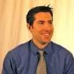 Picture of Aaron Marsters wearing a blue button  up shirt and a gray tie.