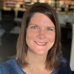Picture of Kristy Hill wearing a blue blouse.