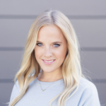 Picture of Rachel Madel wearing a blue sweater with a gold necklace.