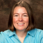 Picture of Stacy Kelly wearing a striped light and dark blue shirt.