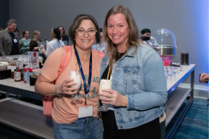 Two women at the ATIA 2025 Celebration. 