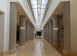 Full columns in the Hall of Cities with a sample logo.
